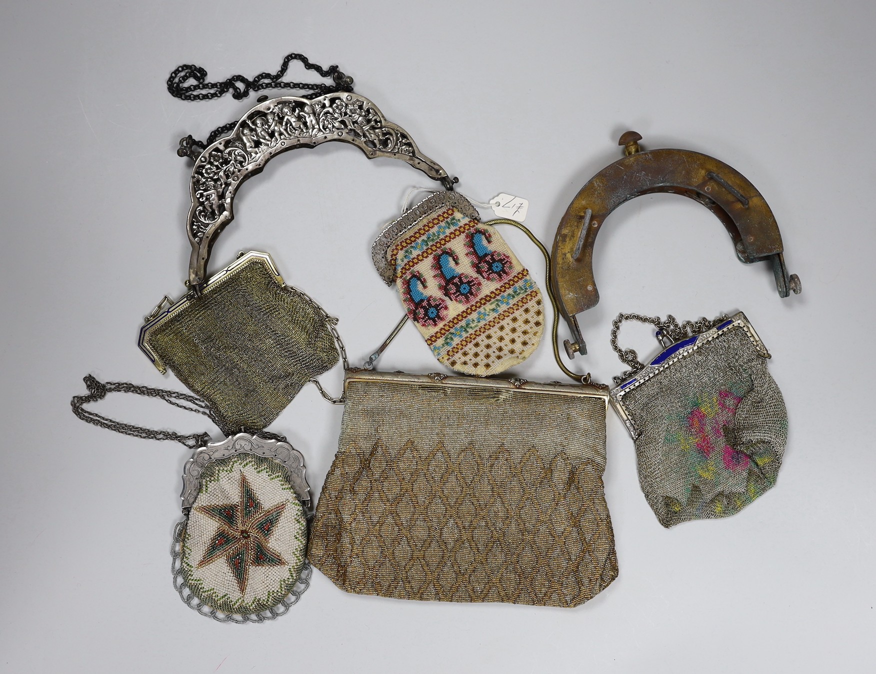 Two chain mail Edwardian handbags with enamelled frames, two 19th century beaded purses and a bag with ornate metal frames and two 20th century large metal bag frames (6)